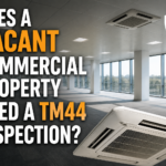 Vacant commercial office with air conditioning units and title asking if a vacant commercial property needs a TM44 inspection.