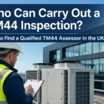 Qualified TM44 assessor inspecting commercial air conditioning units on a rooftop in the UK